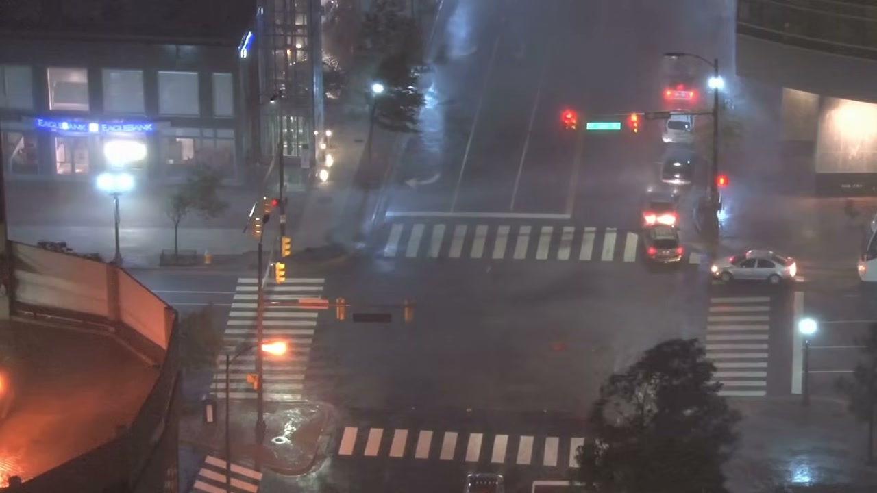 City intersection at night in heavy rain